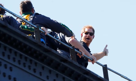 Prince Harry gives a thumbs-up as he climbs the Sydney Harbour Bridge.