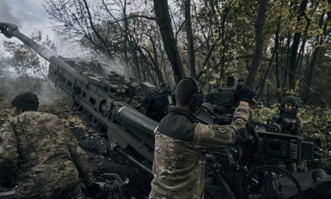 Ukrainian soldiers fire at Russian positions in Ukraine's eastern Donetsk region.