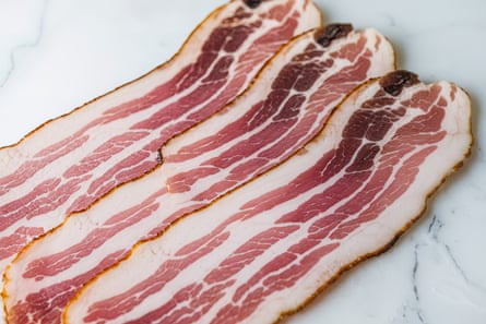 A closeup shot of raw bacon slices