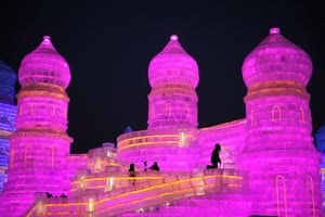 Harbin Ice &amp; Snow World Begins Trial RunHARBIN, CHINA - DECEMBER 18: Tourists visit illuminated ice sculptures at Ice and Snow World park on December 18 2017 in Harbin, China. The Ice and Snow World Park will host the 34th Harbin International Ice and Shold an Ice and Snow Sculpture Festival from January 5 until the end of February.