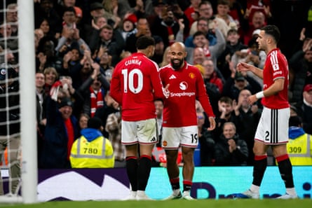 Bryan Mbeumo (centre) celebrates scoring his teams first goal with Matheus Cunha (left) and putting United ahead