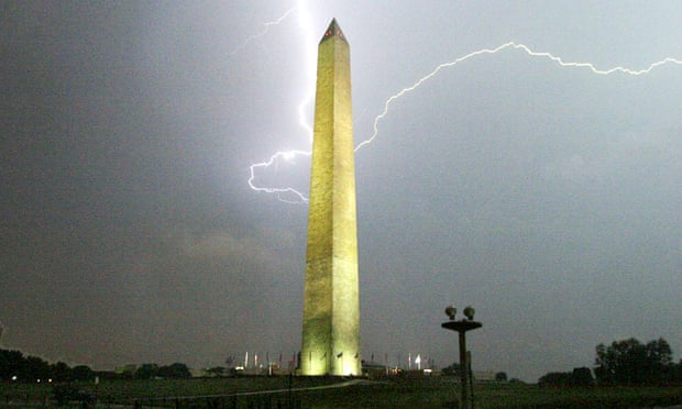 A lightning strike is seen behind the Washington Monument.