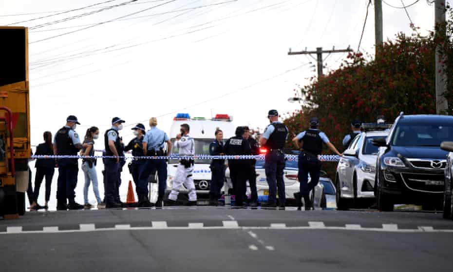 Police work at the scene of a fatal shooting in Guildford, Sydney
