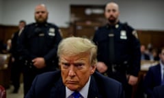 Trump in court with officers behind him.