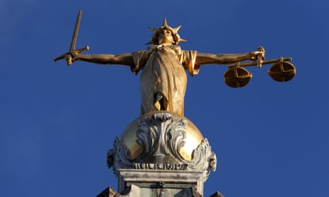 Statue of Lady Justice stands atop the Old Bailey in London. 