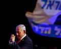 Benjamin Netanyahu clasps his hands together at an election night rally