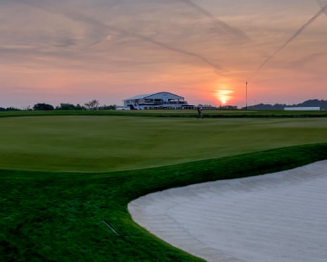 The sun rises alongside the 18th fairway before the first round at Oakmont