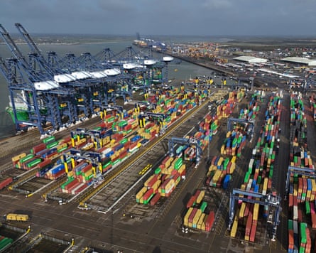 A drone image shows containers being unloaded from ships at the Port of Felixstowe, England