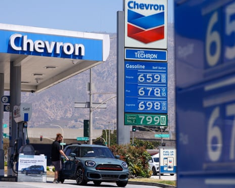 gas station showing prices over $6 a gallon
