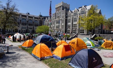 Pro-Palestinian protesters maintain their encampment on the lawn on the campus of CUNY City College, on 26 April.