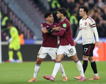 Mateus Fernandes tries to play the peacemaker and stop Lucas Paqueta from confronting the referee Darren England against Liverpool