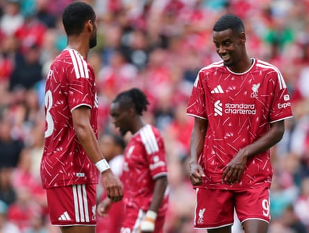 The Liverpool players Cody Gakpo (left) and Alexander Isak (right) share a joke during a pre-season game.