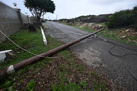 A fallen Jamaica Public Service Company light pole is seen on the Sugar Man's beach main road in Hellshire, St Catherine parish, near Portmore.