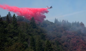 A plane drops fire retardant over the Jones Fire outside Nevada City, California on Monday.