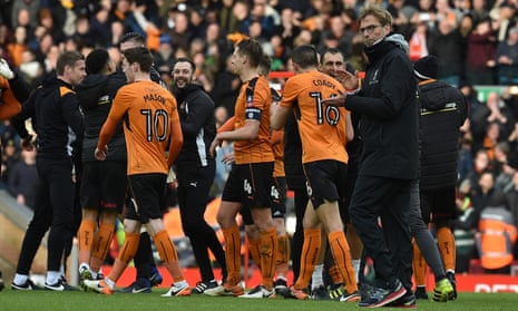Jürgen Klopp congratulates Wolves’ players after their win at Anfield.