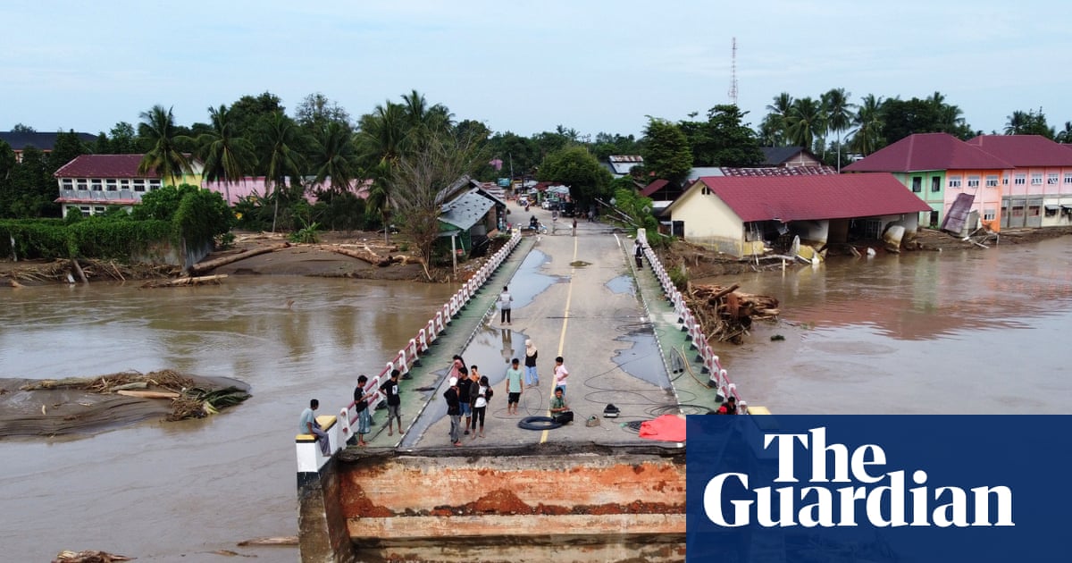 ‘The current could kill an elephant’: Asia flood survivors describe escaping with their lives