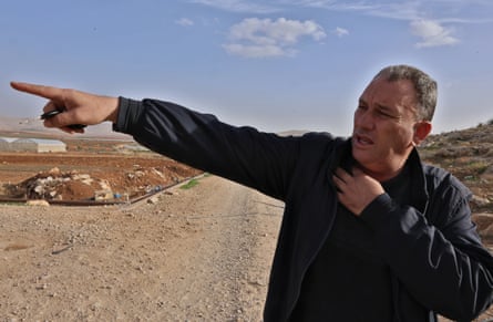 Abdullah Bsharat points to somewhere out of the picture