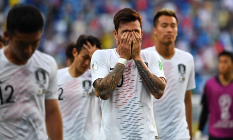 South Korea’s Jang Hyun-soo and his teammates react to their defeat.