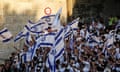 Marchers waving Israeli flags on Jerusalem Day