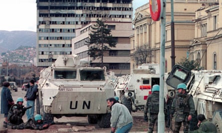 UN peacekeepers and Sarajevo citizens take cover from gunfire on the city’s infamous ‘Sniper Alley’, March 1993.