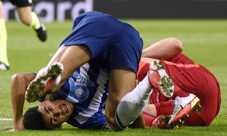 Porto’s Luis Diaz (left) falls next to Liverpool’s James Milner.