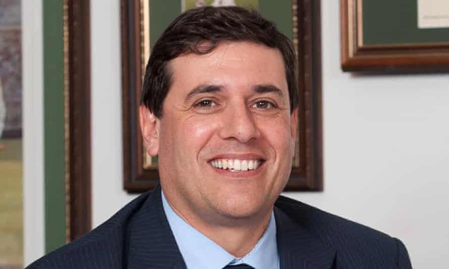 smiling white man in suit and tie