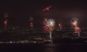 Fireworks light up the sky above Funchal Bay, Madeira Island.