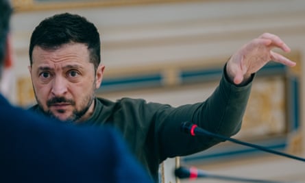 Zelenskyy gestures as he speaks