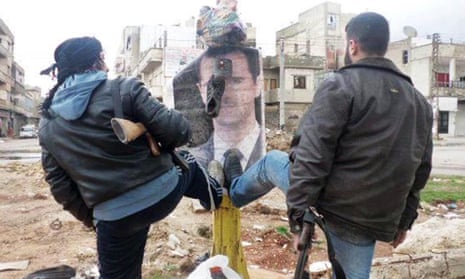 Syrian rebels step on a portrait of Bashar al-Assad