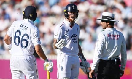Ben Stokes and Joe Root of England talk pinch umpire Sharfuddoula arsenic play is concisely paused owed to a swarm of ladybirds