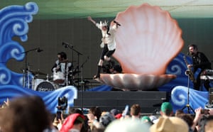 The performer jumps out of an oversize clam shell