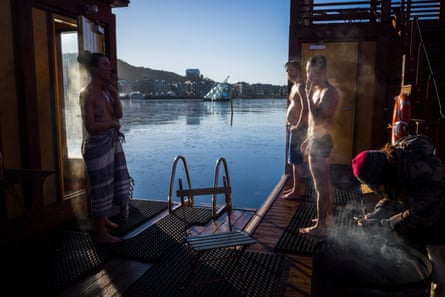 people in a sauna on a fjord