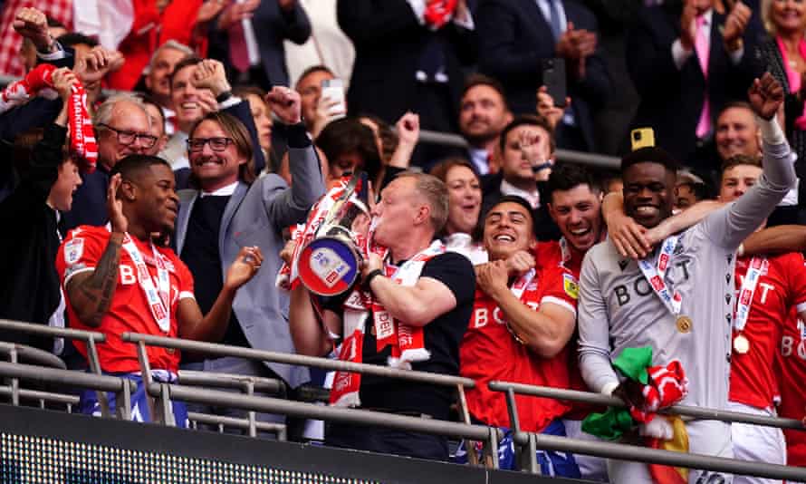 Nottingham Forest’s manager Steve Cooper kisses the Championship Playoffs trophy.