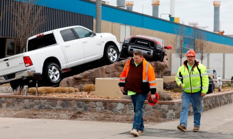 Construction workers leave FCA Chrysler Warren Truck Assembly after the Detroit three automakers have agreed to UAW demands to shut down all North America plants as a precaution against coronavirus.