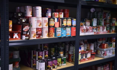 Tins of food on the shelves at the Tri Service Support Centre food bank in Newcastle-under-Lyme, England. 
