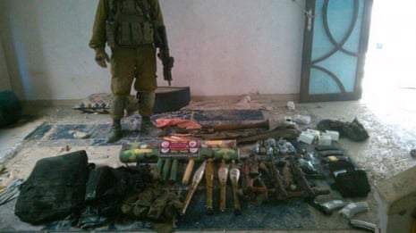 A handout image of weapons and equipment from the IDF which the Israeli military claims it found at a house in a location given as Gaza.
