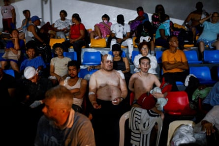 People receive treatment in a field hospital in La Guaira, Venezuela