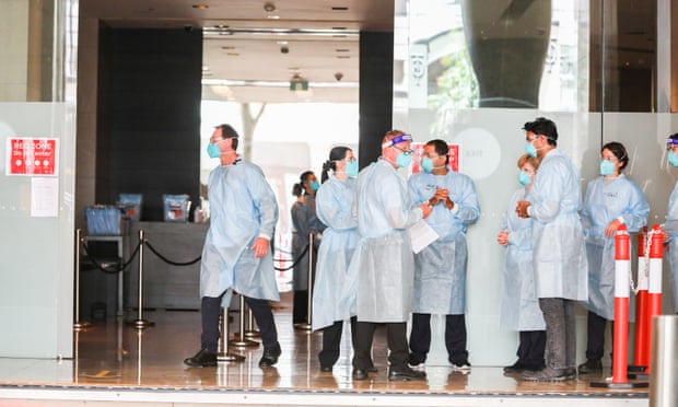 Hotel quarantine workers wearing full PPE at the Grand Hyatt Melbourne hotel.
