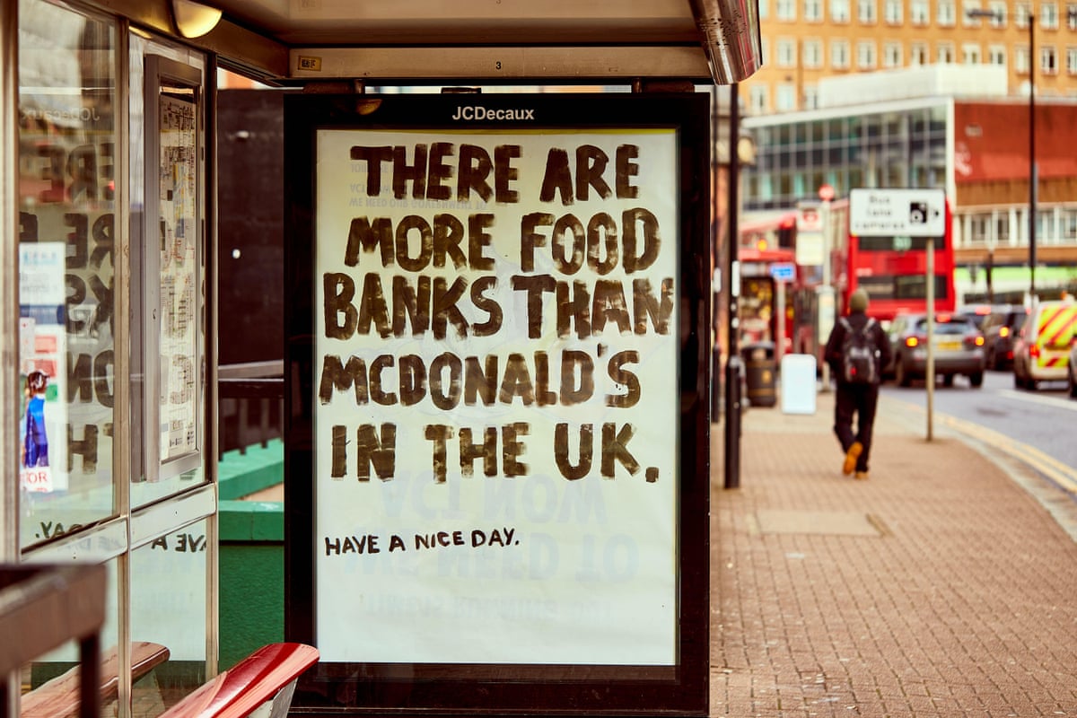 A fly-poster at a bus stop highlights the recent statistic that there are now more McDonalds than food banks in the U.K.