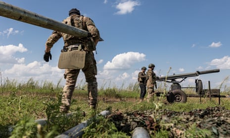 Ukrainian soldiers load grad shells at their position in the direction of Bakhmut.