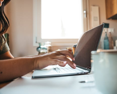 Woman typing on laptop keyboard