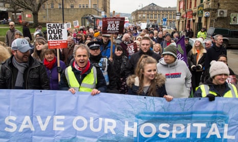 Protesters march to about the planned closure of the A&amp;E department at Huddersfield royal infirmary.