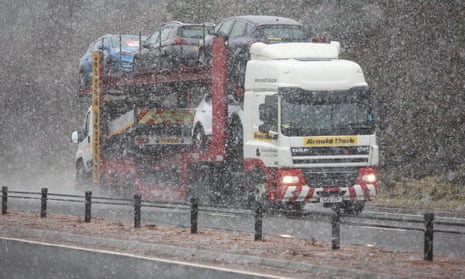 A lorry on the A9 near Inverness where blizzards are being blown by 90mph winds.