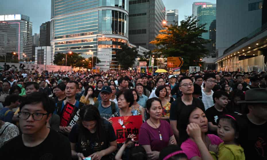 Hong Kong residents attend the protest against a move by the government to allow extraditions to China