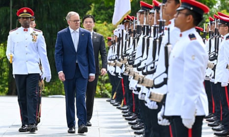 Anthony Albanese inspects an honour guard with Singapore’s deputy prime minister, Lawrence Wong, at the Istana in Singapore on Friday.