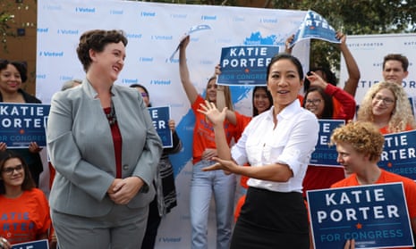 Democratic congressional candidate Katie Porter, left, is introduced by former Olympic medalist ice skater Michelle Kwan to students and supporters before voting early at the University of California campus in Irvine, California, on Tuesday.