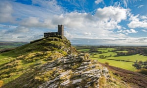 On a sunny day, the church of St Michael de Rupe, atop Brent Tor, Devon