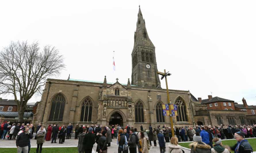 People queue outside Leicester Cathedral to view the coffin holding the remains of Richard III.