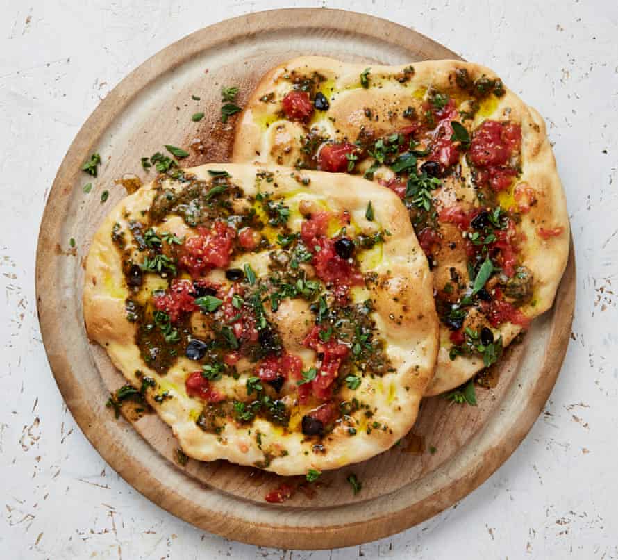 Olive oil flatbread with three-garlic butter and grated tomatoes