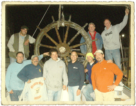 A crew of shipwreck divers on a boat
